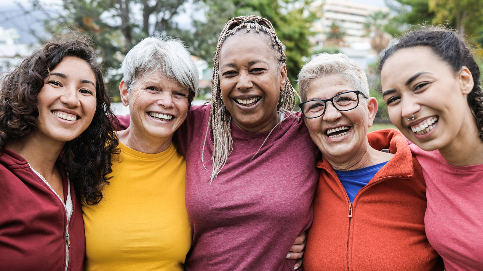 Group of diverse multi-generational women smiling