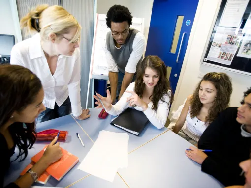 Teenage Students and Teacher in a Class Debate