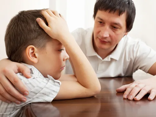 Father Comforts Sad Child