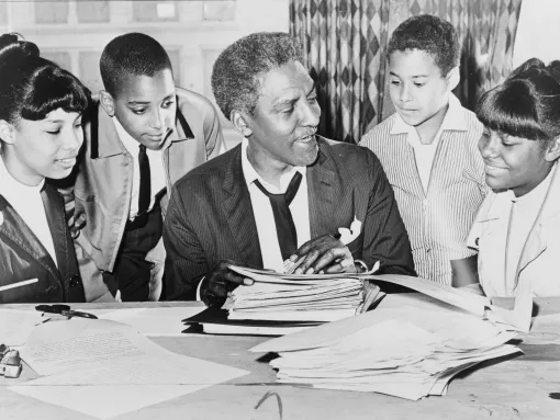 Bayard Rustin Speaking with Kids before Demonstration