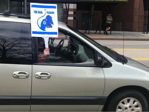 Antisemitic sign at "lockdown" protest