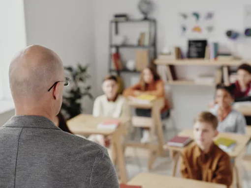 Teacher teaching young students in a classroom