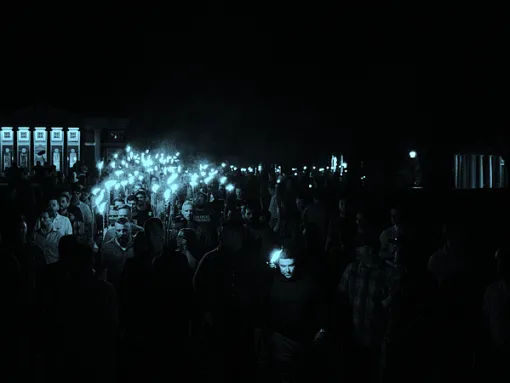Blue-tinted photo of a far right rally.