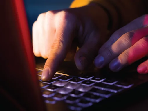 Fingers typing of laptop keyboard