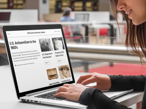 Young female studying about antisemitism on a laptop