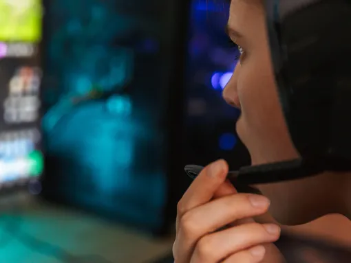Young woman gamer playing