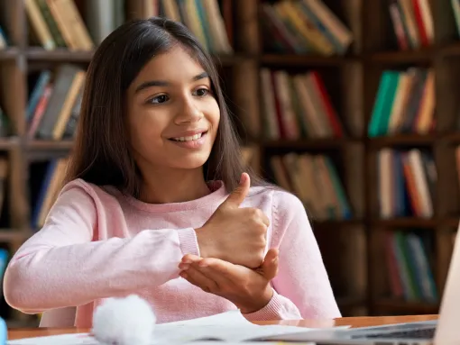 Smiling Indian/Latin school girl who is deaf