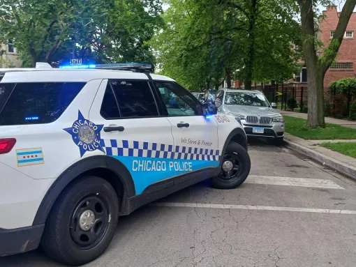 A police car is seen outside the Albany Park apartment in Chicago, Illinois, of Elias Rodriquez