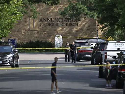 Police work the scene following a mass shooting at Annunciation Catholic Church on August 27, 2025, in Minneapolis, Minnesota