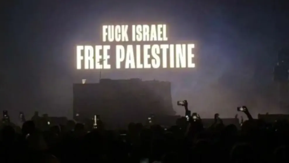 The statement “Fuck Israel Free Palestine" displayed on stage of Kneecap’s Coachella performance