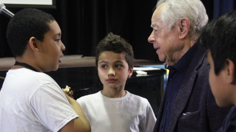 Students talking with Holocaust Survivor Mark Schonwetter